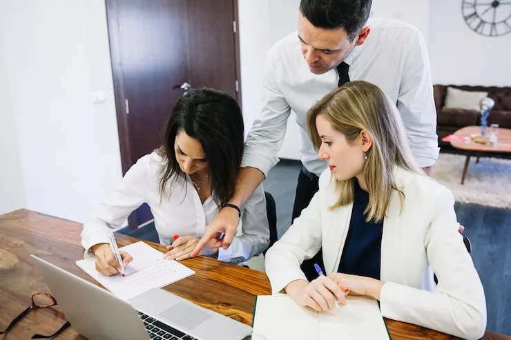 Professional accounting team collaboration at Pearl Lemon Accountants UK office showing why clients choose expert financial services