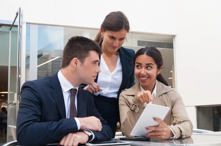 Group of professionals discussing tax strategies for dentists.