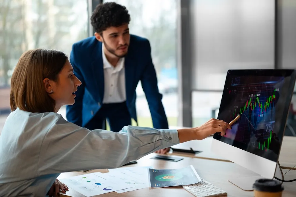 Professional accountants analyzing financial charts and data for sole trader business accounting services