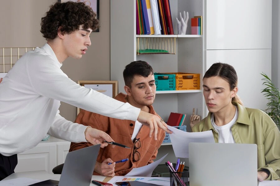group of professionals discussing financial documents in office