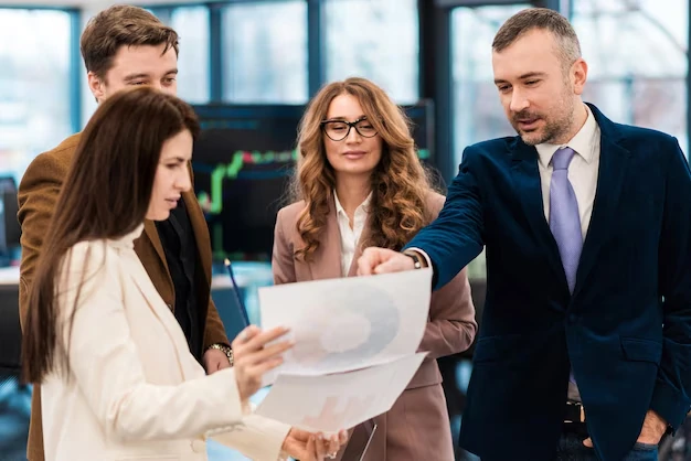 business team reviewing financial reports and charts