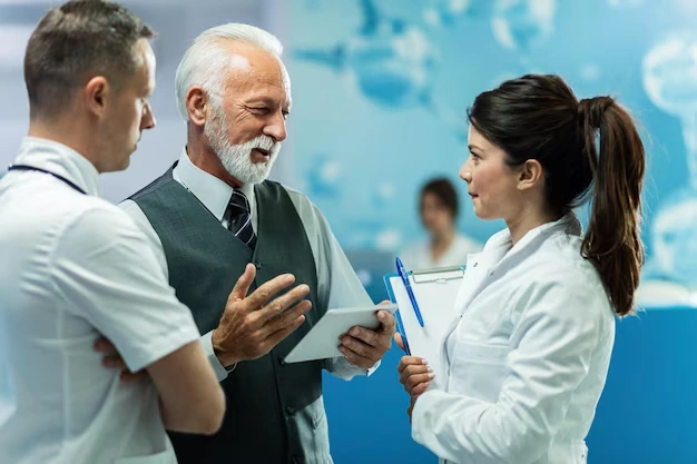 doctors discussing financial matters with a tablet