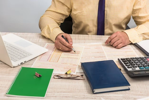 Businessman reviewing tax documents at a desk