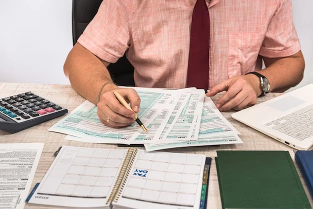 Man reviewing tax documents at a desk
