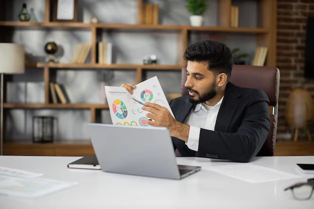 Stress-free self-assessment for writers, with a clear and organized workspace featuring a laptop and paperwork, symbolizing efficient tax management.