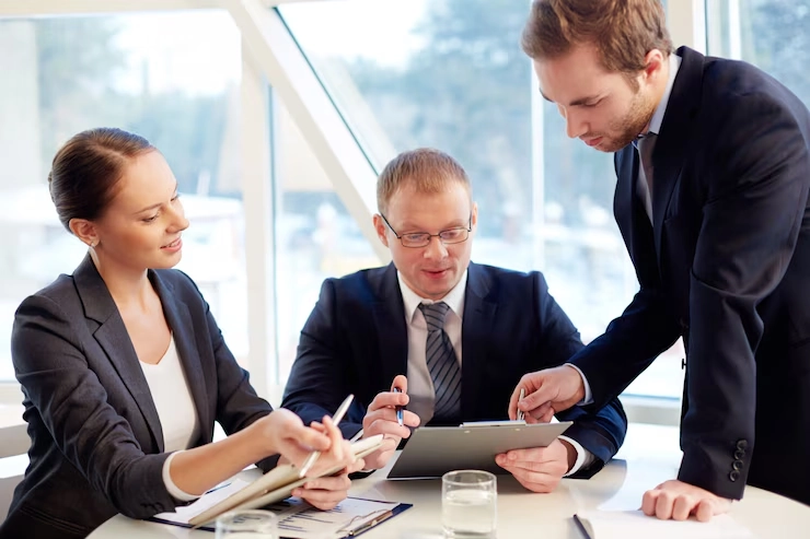 Corporate governance audit professionals discussing strategies in a business meeting.